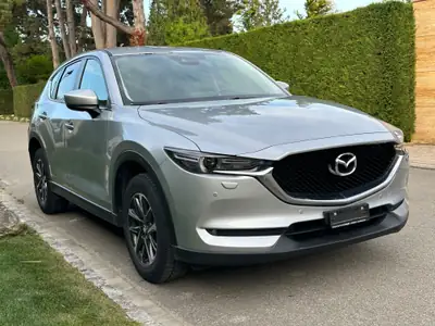 Mazda CX-5 SKYACTIV-G 160 Ambition AWD — SUV fiable, entretien complet, 4x4 performant — fianco