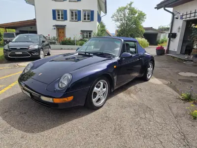 Porsche 911 Carrera Cabrio 1995 — Roadster iconique, 272 ch et toit ouvert — rear view