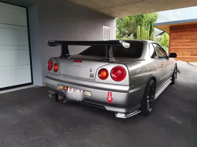 Nissan Skyline R34 — Coupé légendaire, 527 ch, boîte manuelle, sans sinistre — fianco