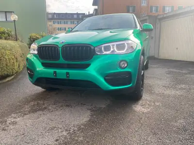 BMW X6 xDrive 30d — SUV coupé premium diesel, covering vert métallisé personnalisé — intérieur