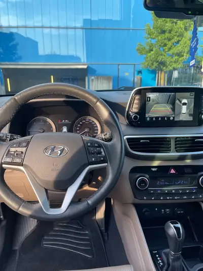 Hyundai Tucson 2.0 CRDI Mild Hybrid 4WD — SUV robuste, sans accident, finition Champagne — rear view