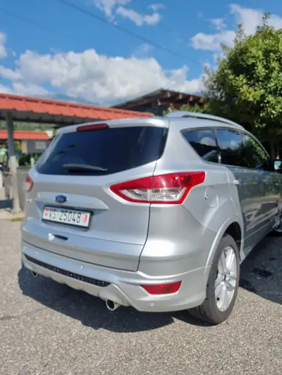 Ford Kuga 2.0 TDCi Carving 4WD — SUV robuste diesel, expertise du jour incluse — côté