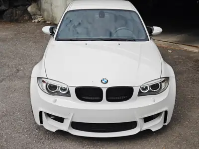 BMW 1er M Coupé 2011 — 340 ch, boîte manuelle, excellent état — côté