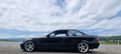BMW M3 E36 Coupé 1996 — Icône sportive des années 90, 321 ch purs — côté