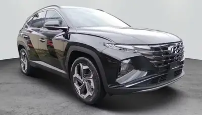 Hyundai Tucson 1.6 TGDI HEV Amplia — SUV hybride essence, 29 000 km seulement — fianco