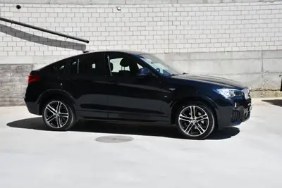 BMW X4 xDrive 28i M Sport — SUV coupé sportif, 43 500 km seulement — Heckansicht