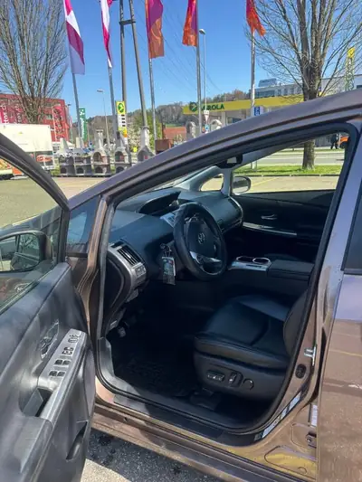 Toyota Prius+ 1.8 VVT-i HSD Sol Premium — 7 places, hybride économe, sans accident — cruscotto