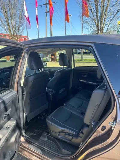 Toyota Prius+ 1.8 VVT-i HSD Sol Premium — 7 places, hybride économe, sans accident — Miniatura 9
