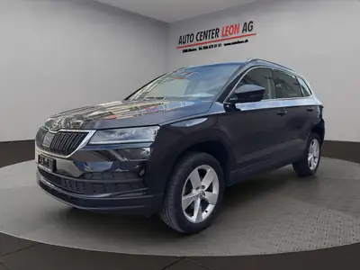 Skoda Karoq 1.6 TDI — SUV compact robuste, sans accident, entretien à jour — side view