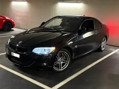 BMW 335i xDrive Coupé — Sportivité allemande et traction intégrale — rear view