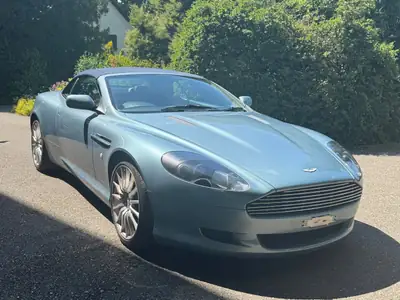 Aston Martin DB9 Cabriolet 2006 — Roadster britannique d'exception, 457 ch et rare teinte bleue — fianco