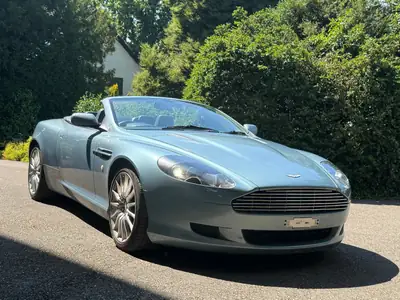 Aston Martin DB9 Cabriolet 2006 — Roadster britannique d'exception, 457 ch et rare teinte bleue — cruscotto