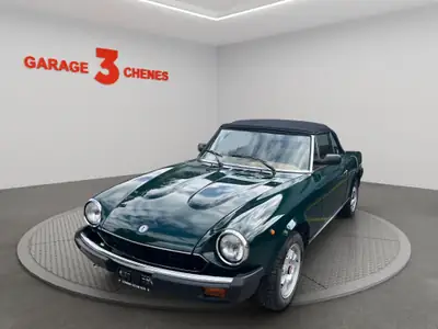 Fiat 124 Spider Pininfarina DS — Roadster vintage iconique, 98'000 km, vert métallisé — vue extérieure