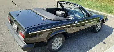 TRIUMPH TR7 1982 — Cabriolet britannique authentique, 64'000 km d'origine — fianco