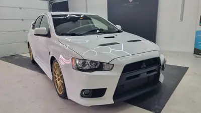 Mitsubishi Lancer Evo X MR — Berline sportive 295 ch, historique complet — vue extérieure