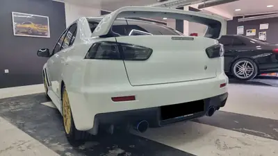Mitsubishi Lancer Evo X MR — Berline sportive 295 ch, historique complet — arrière