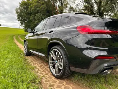 BMW X4 M40i Steptronic — SUV coupé sportif, 360 ch et très faible kilométrage — Seitenansicht