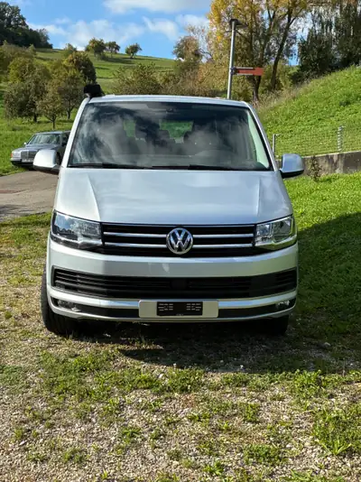 VW T6 Caravelle — Minibus 9 places diesel, idéal famille et professionnels — side view