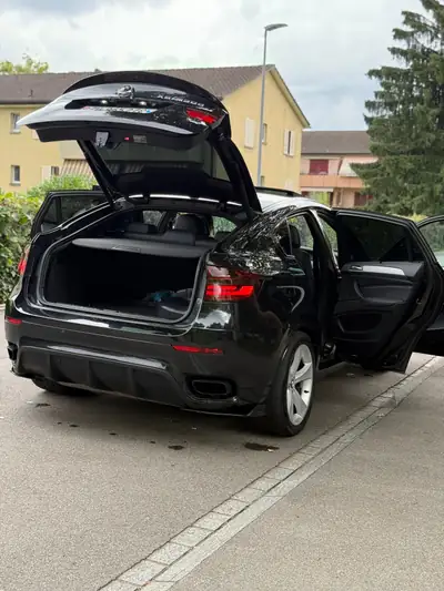 BMW X6 M50d Steptronic — SUV coupé premium diesel 381 ch, entretien maîtrisé — side view