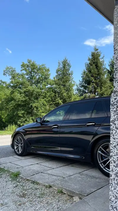 BMW 540i xDrive Touring — Berline Familiale Prestige, 340 ch et Tout-Terrain — rear view