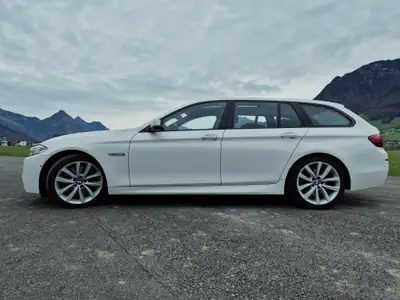 BMW M550d Touring xDrive — Break diesel haute performance, entretien suivi — side view