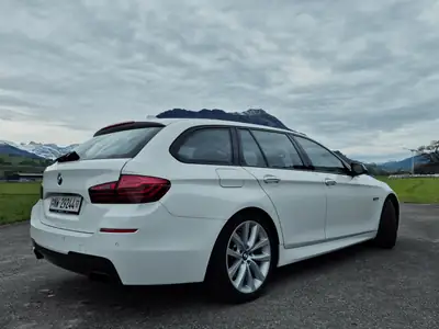 BMW M550d Touring xDrive — Break diesel haute performance, entretien suivi — rear view