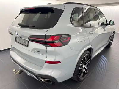 BMW X5 xD 48V 30d M Sport Pro 2025 — SUV premium 7 places, hybride mild, très faible kilométrage — rear view