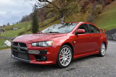 Mitsubishi Lancer Evo X GSR TC-SST — Légende sportive, 36'000 km, son Rockford Fosgate — côté