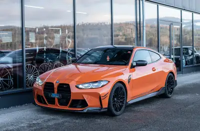 BMW M4 Coupé Competition — 510 ch, Orange métallisé, garantie 12 mois — side view