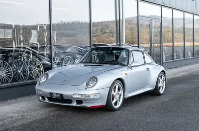 Porsche 911 Carrera 4S 1995 — Coupé sportif iconique, première main avec historique complet — fianco