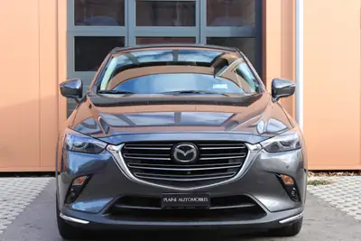 Mazda CX-3 SKYACTIV-G 121 — Compact SUV urbain, tempomat adaptatif et sièges chauffants — côté