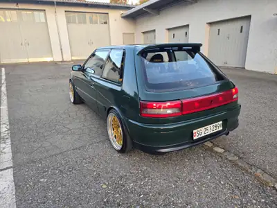 Mazda 323 GT-R 4WD 1993 — Légende de l'homologation sportive, 229 ch et transmission intégrale — detail