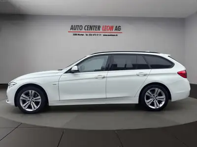 BMW 320d xDrive Touring — Break diesel performant, 4x4 intégral, entretien à jour — rear view