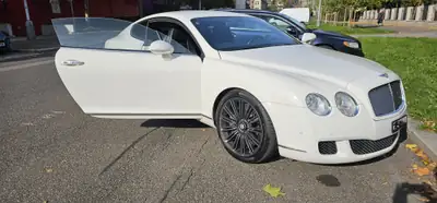 Bentley Continental GT 6.0 — Gran Turismo luxe, 560 ch et entretien Bentley complet — Heckansicht