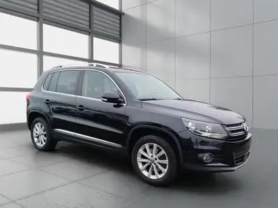VW Tiguan 2.0 TDI BlueMotion — SUV robuste, transmission intégrale, entretien exemplaire — side view