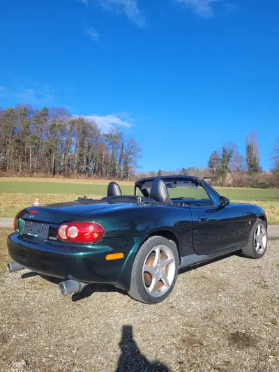 Mazda MX-5 1.8i-16 GT — Cabriolet sportif iconique, édition 10e anniversaire — fianco
