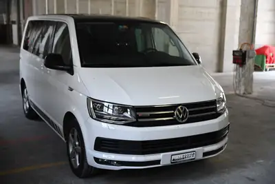 VW T6 Multivan 2.0 Bi-TDI Comfortline — Ludospace 7 places, Transmission intégrale DSG — side view