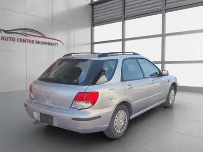 Subaru Impreza 1.6 Cool — Berline polyvalente avec transmission automatique et 4x4 intégral — rear view