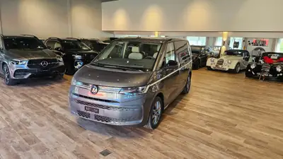 VW T7 Multivan 1.5 eHybrid Style 4Motion — Minibus hybride rechargeable, 7 places, quasi neuf — side view