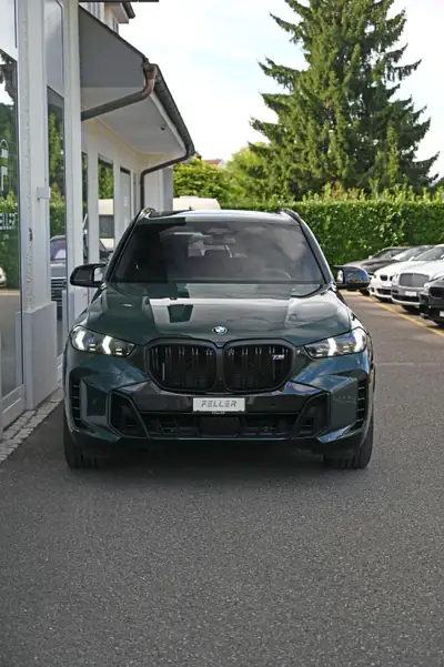 BMW X5 xDrive 48V M60i M Sport Pro — SUV premium 530 ch, finition exclusive verte — side view