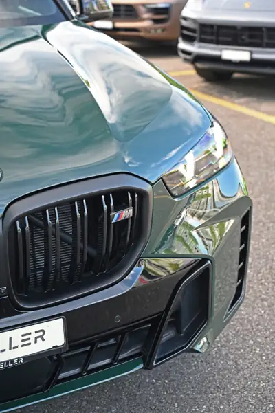 BMW X5 xDrive 48V M60i M Sport Pro — SUV premium 530 ch, finition exclusive verte — rear view