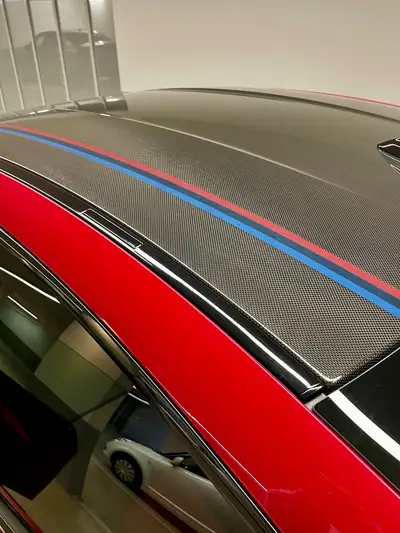 BMW M4 Heritage Limited Edition — Coupé sportif 450 ch, 10 000 km seulement — Seitenansicht