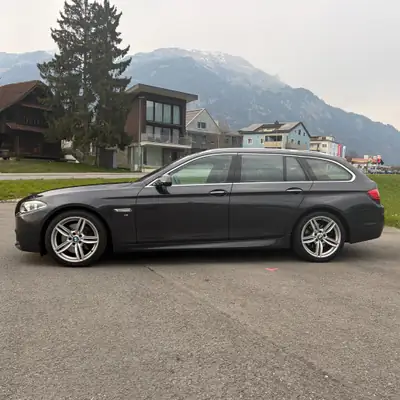BMW 528i Touring xDrive — Monospace premium tous terrains, 245 ch et traction intégrale — Heckansicht