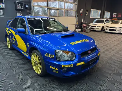 Subaru Impreza WRX 2.0 Turbo 4WD — Berline sportive iconique, rallye optik, frais contrôle technique — rear view