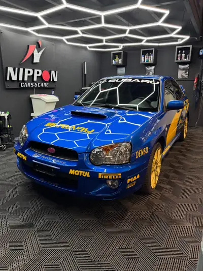 Subaru Impreza WRX 2.0 Turbo 4WD — Berline sportive iconique, rallye optik, frais contrôle technique — side view