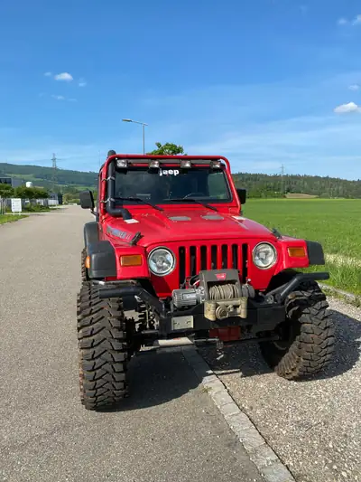 Jeep Wrangler 4.0 Sport S.Top 1997 — Le SUV légendaire, 177 ch et seulement 65'200 km — fianco