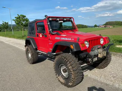 Jeep Wrangler 4.0 Sport S.Top 1997 — Le SUV légendaire, 177 ch et seulement 65'200 km — vista esterna