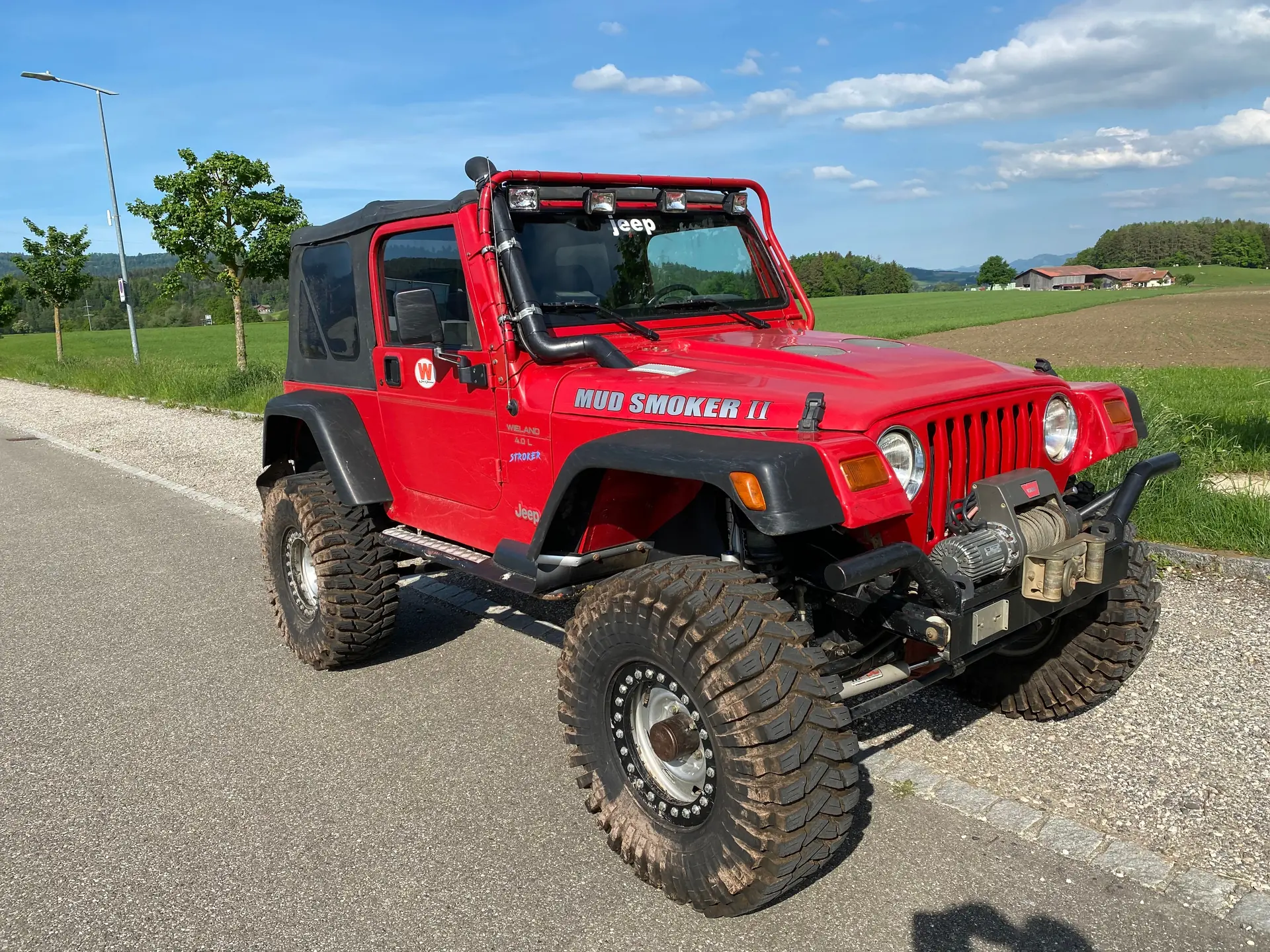 Jeep Wrangler 4.0 Sport S.Top 1997 — Le SUV légendaire, 177 ch et seulement 65'200 km — vista esterna