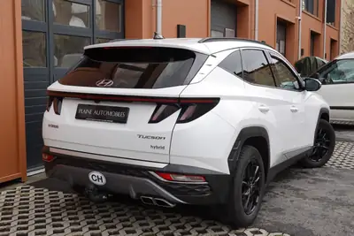 Hyundai Tucson 1.6 TGDI HEV Amplia 4WD — SUV hybride essence, 8 roues, seulement 138 500 km — Miniatura 7