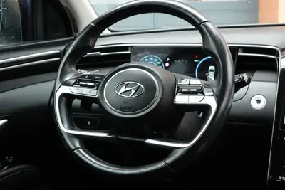 Hyundai Tucson 1.6 TGDI HEV Amplia 4WD — SUV hybride essence, 8 roues, seulement 138 500 km — Miniatura 13